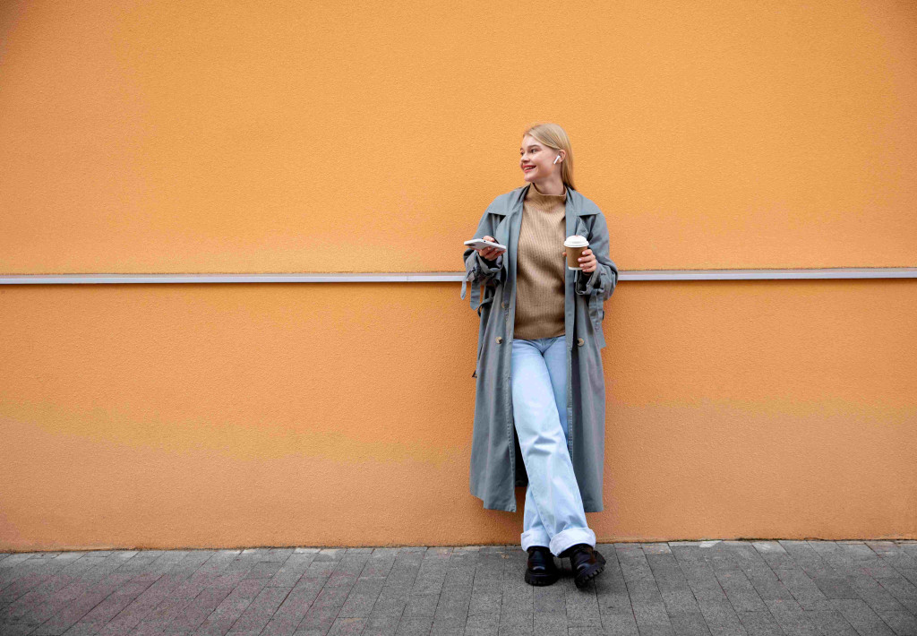 full-shot-woman-with-phone-coffee-cup.jpg
